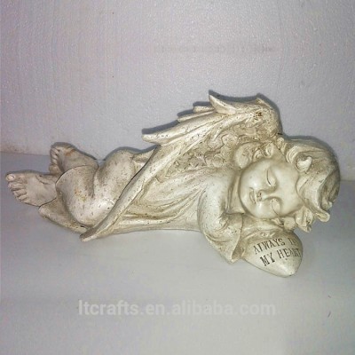 White sleeping little angel figurine type clay garden angel